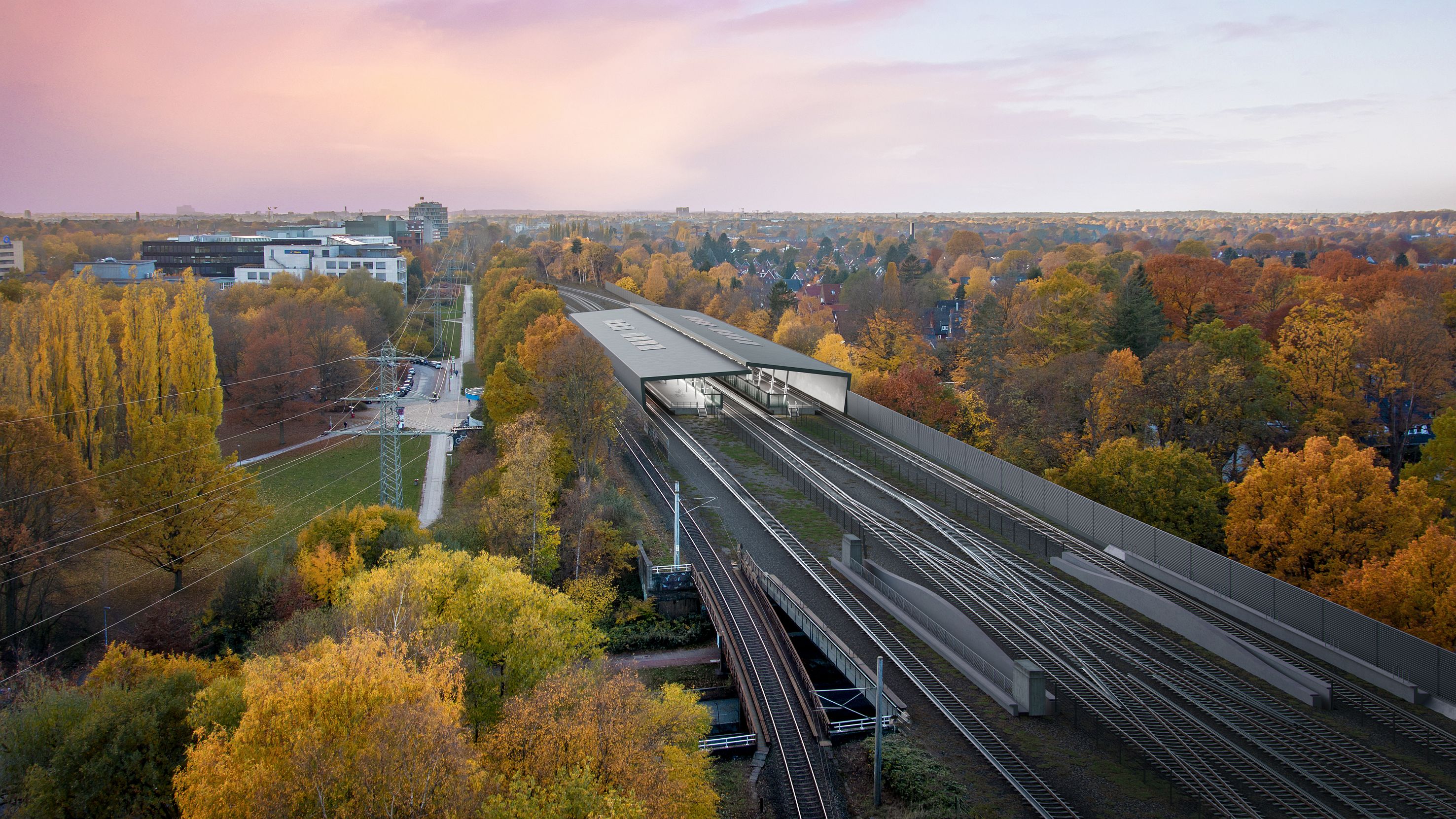 Luftaufnahme von einem Schienennetz mit Bahnhof.  
