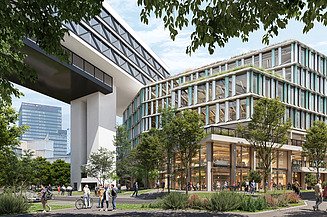 The picture shows an office building with trees in front of it