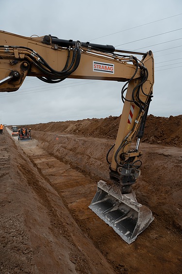 Photo of an excavator on a building site. 