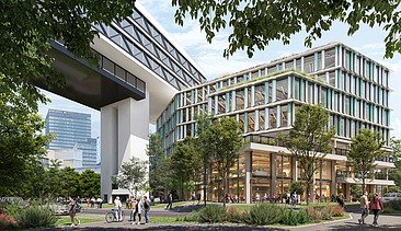 The picture shows an office building with trees in front of it