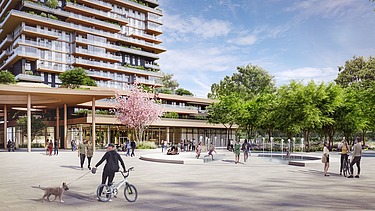 Photo shows a residential tower with a car-free forecourt and some walkers