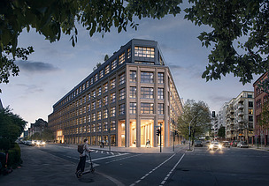 Street corner with a large illuminated building