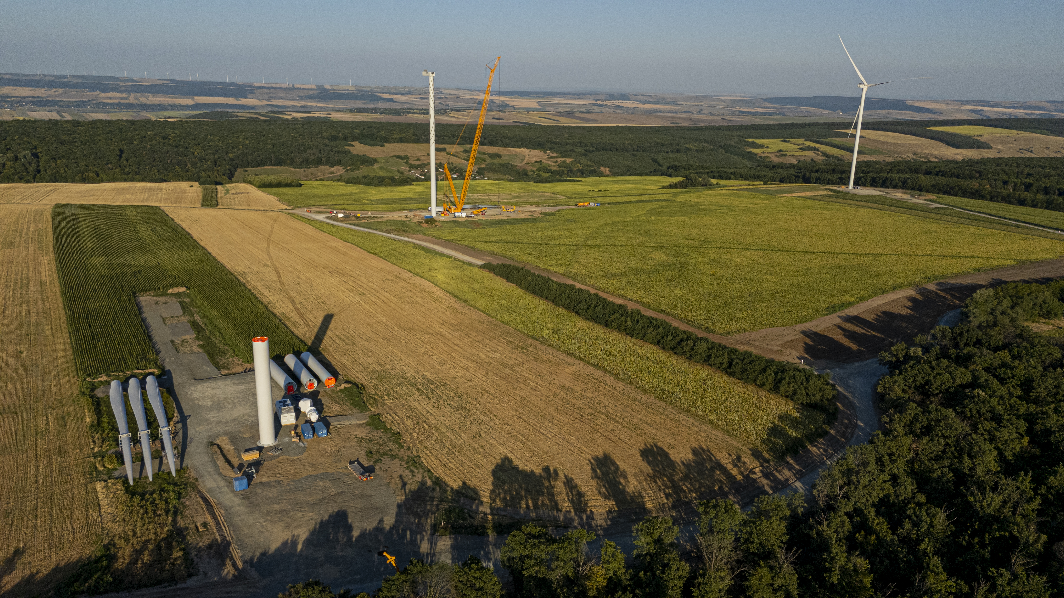 Bird's eye view of the Deleni wind farm, rotor blades are being attached to one of the wind turbines at this moment