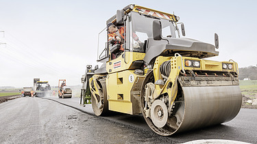 Photo of a roller, working on a road