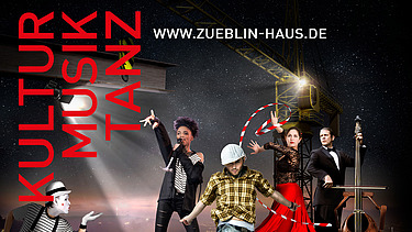 Menschen stehen auf einer Bühne und tanzen und singen