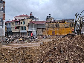 Photo shows a building that was half destroyed by an earthquake