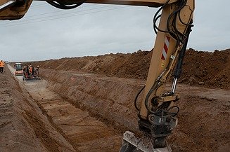 Photo of an excavator on a building site. 