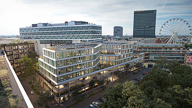 The picture shows an office building in an aerial view, with other buildings and a Ferris wheel in the background