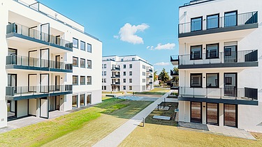 Visualisierung von einem Wohnpark, mit mehreren Gebäuden.  
