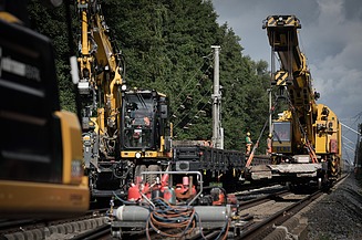 Image of construction machinery during track construction