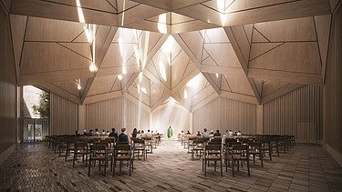 The picture shows a brightly lit interior with wooden walls