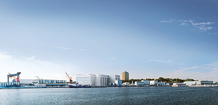 Photo of a harbor area by the sea, with blue sky