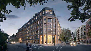 Street corner with a large illuminated building