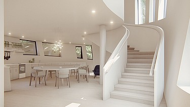 Visualisierung vom neuen Maggie’s Centre am Royal Free Hospital von innen. Es ist eine Treppe zu sehen und Tische und Stühle.  