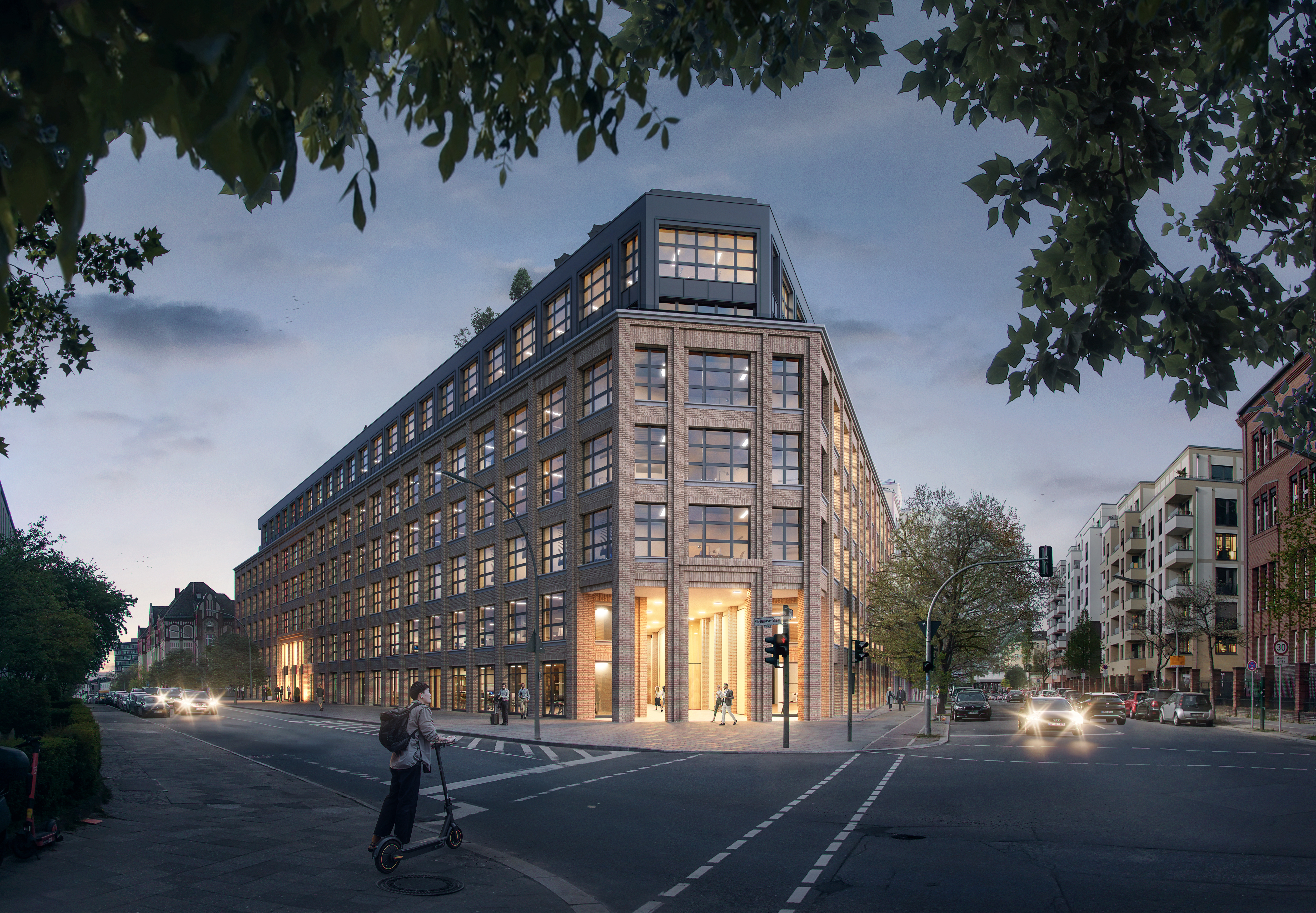 Straßenecke mit einem großen beleuchten Gebäude