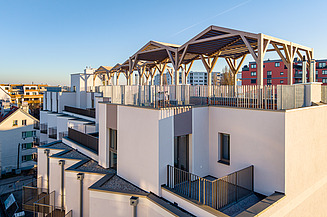 The roofs feature inviting pergolas and extensive greenery. 