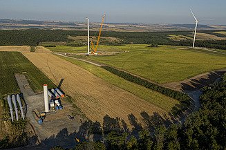 Bird's eye view of the Deleni wind farm, rotor blades are being attached to one of the wind turbines at this moment
