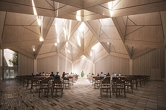 The picture shows a brightly lit interior with wooden walls