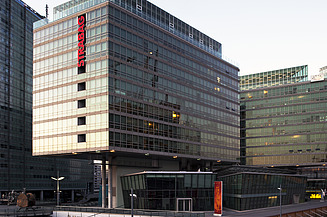The illuminated STRABAG office can be seen at dusk in Vienna. 