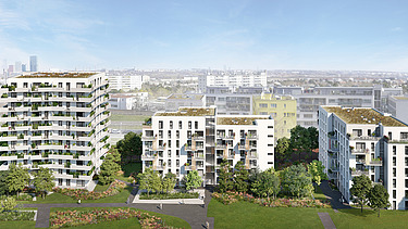 Photo of several new residential buildings, in front of a green meadow
