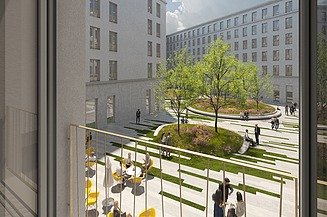 Visualisierung eines Bürogebäudes mit Blick aus dem Fenster auf den Innenhof. 