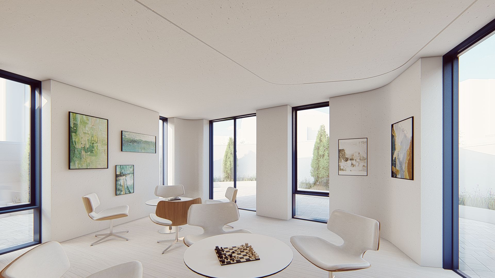 Visualisierung vom neuen Maggie’s Centre am Royal Free Hospital von innen. Alles ist weiß gehalten und Tische und Stühle sind zu sehen. An den Wänden hängen Bilder. 