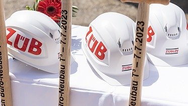 Photo of three helmets and three divisions.