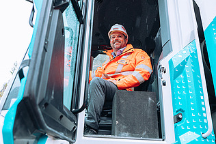 STRABAG CEO Klemens Haselsteiner sitting in the wheel loader.