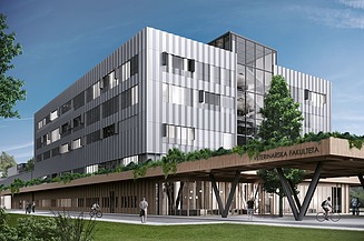 Photo of a modern four-story building under a blue sky