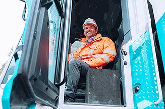 STRABAG CEO Klemens Haselsteiner sitting in the wheel loader.