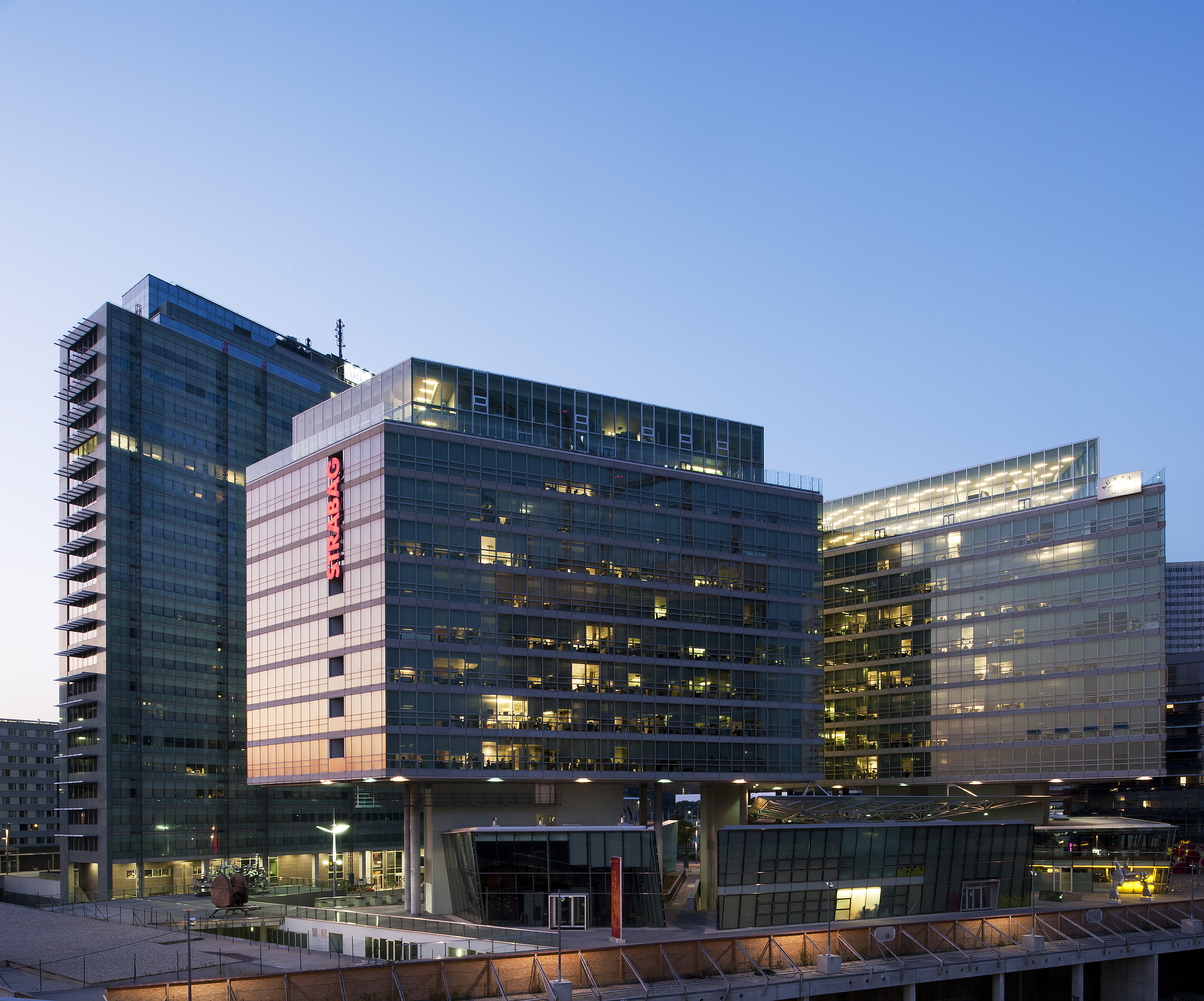 The illuminated STRABAG office can be seen at dusk in Vienna. 