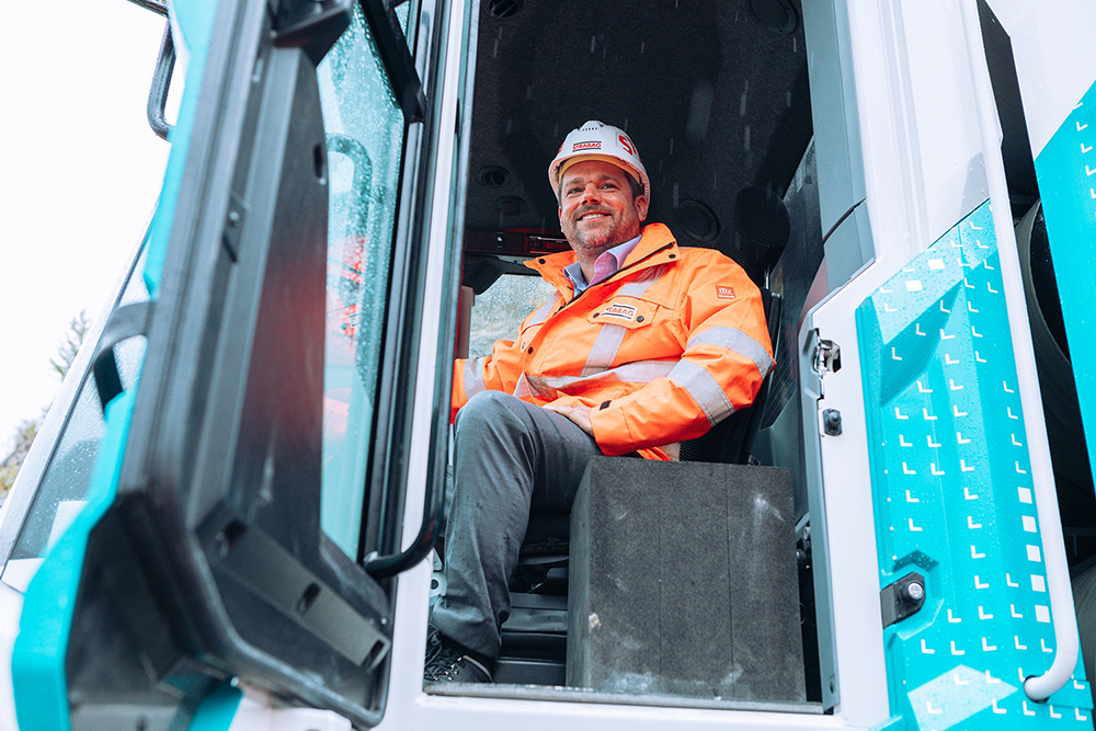 STRABAG CEO Klemens Haselsteiner sitting in the wheel loader.