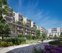 Photo of new buildings with green space and blue sky