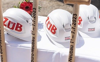 Photo of three helmets and three divisions.