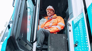 STRABAG CEO Klemens Haselsteiner sitting in the wheel loader.