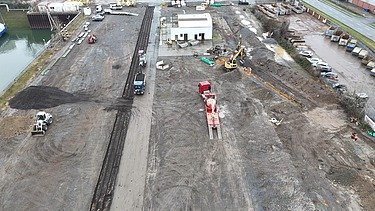 Photo from a bird's eye view. You can see a building site