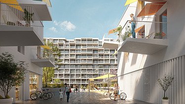 Das Bild zeigt einen Innenhof eines modernen Wohnbaukomplexes