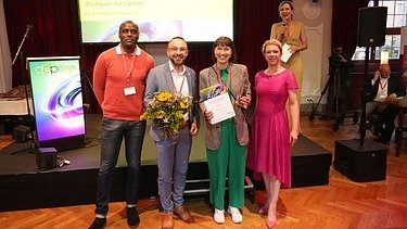 Photo of four smartly dressed people at the German Demography Award