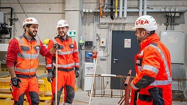 STRABAG CEO Klemens Haselsteiner together with apprentices