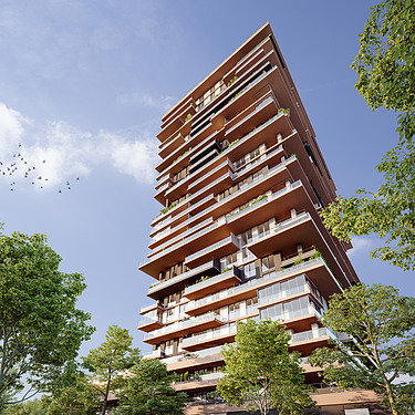 Photo shows a residential tower with trees left and right
