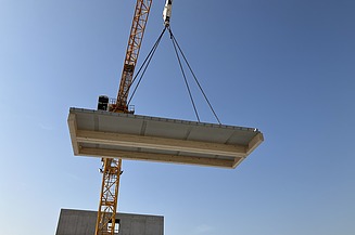 Crane lifts a component into the air