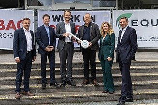 Photo of six people standing at the symbolic handover of the construction site