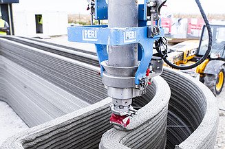 Photo of a 3D printer for construction at work